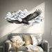 Soaring eagle and snowy mountain wall decal above a sofa