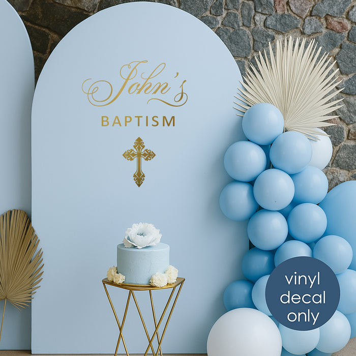 Custom baptism vinyl decal “John’s Baptism” with gold cross on blue backdrop for christening photo zone decoration