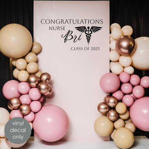 Custom graduation vinyl decal “Congratulations Nurse Bri Class of 2025” with medical symbol for party backdrop decoration