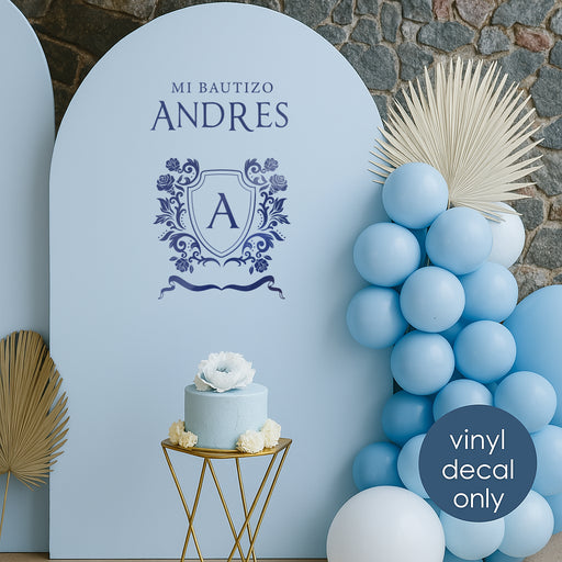 Spanish “Mi Bautizo Andres” vinyl decal in blue with crest monogram for baptism backdrop decoration
