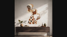 Slow zoom toward a woman holding a cup of coffee, with flowing hair and a warm checkered outfit