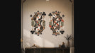 Slow zoom toward a richly patterned king and queen of clubs with red, cream, black, and olive details
