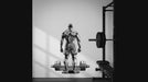 Bodybuilder and barbell gym wall decal in an interior view