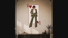 Slow zoom toward a queen of hearts playing card with a stylish woman in a hat and tailored outfit