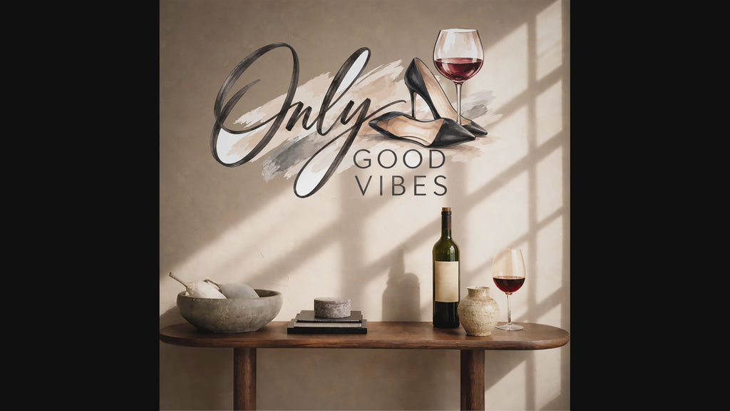 Slow zoom toward the words Only Good Vibes with a wine glass and elegant black heels