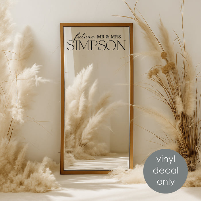 Custom vinyl decal “Future Mr & Mrs Simpson” on mirror backdrop for engagement or wedding decoration