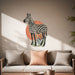 Zebra with botanical leaves and terracotta circle wall decal in an interior
