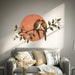 Two love birds perched on a branch before a sunset wall decal shown in a contemporary interior 04 room interior.