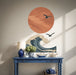 Seagulls over an ocean wave and sun wall decal shown in a coastal 01 room interior.