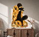 Woman with black cat wall decal shown in a boho interior 03 room