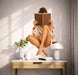 Woman reading wall decal shown in a scandinavian interior 02 room