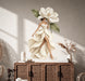 Colorful Magnolia Woman in Petal Dress Wall Decal Art displayed in a boho interior interior