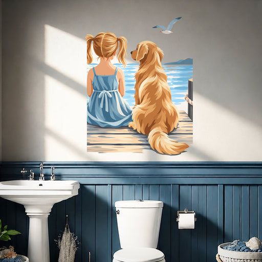 Girl and golden retriever by the sea wall decal in a coastal bathroom