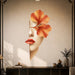 Woman's face with an orange flower and red lips vinyl wall decal in a art deco room