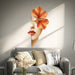 Woman's face with an orange flower and red lips vinyl wall decal in a contemporary room