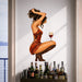 Woman in a red dress with a wine glass vinyl wall decal in a contemporary bar cart room