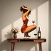Woman in a red dress with a wine glass vinyl wall decal in a mid century modern room