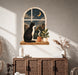 Colorful a seated cat looking through an arched window at a moonlit city scene, with plants and a cup below in boho interior 03 interior