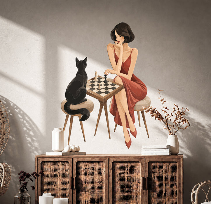 Woman and black cat facing each other across a chessboard wall decal above a cabinet.