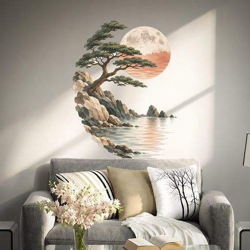 Pine tree, moon and seascape wall decal above a living room sofa.