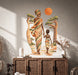 African mother and child walking under an orange sun wall decal above a cabinet.