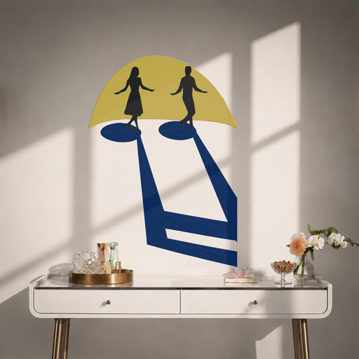 Two dancers beneath a yellow umbrella above a console table