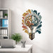 Brain and light bulb wall decal above an office desk