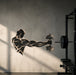 Dumbbell athlete wall decal on a dark gym wall