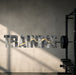 TRAINING typography wall decal beside gym equipment