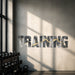 TRAINING typography wall decal on a bright gym wall